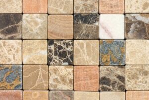 A close-up view of various natural stone tiles arranged in a mosaic pattern.